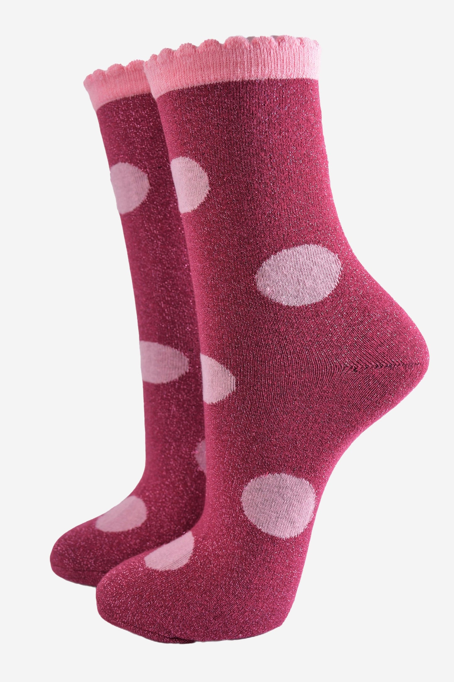 berry red socks with a large light pink polka dot pattern and scalloped cuff