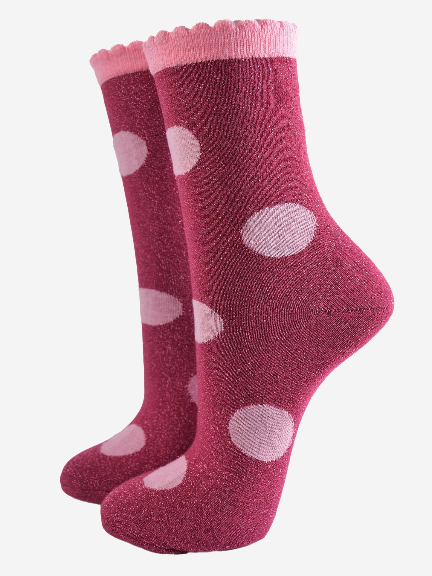 berry red socks with a large light pink polka dot pattern and scalloped cuff