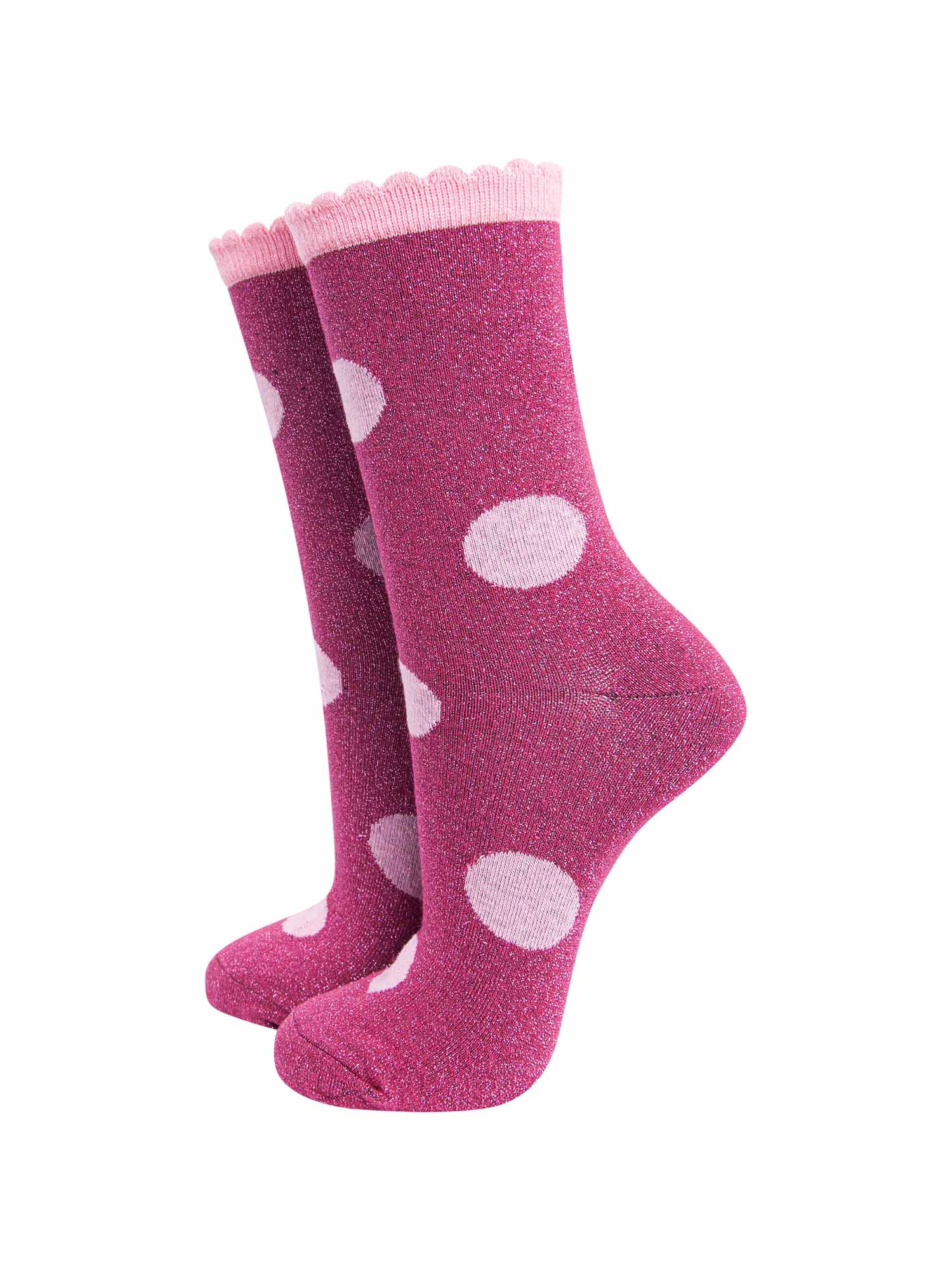 berry red socks with a large light pink polka dot pattern and scalloped cuff