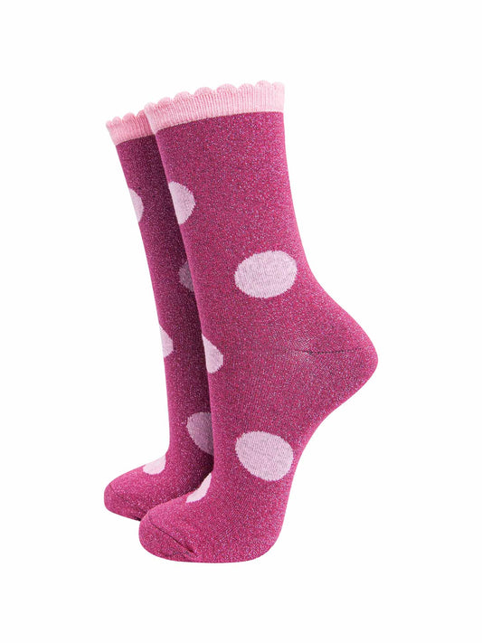 berry red socks with a large light pink polka dot pattern and scalloped cuff