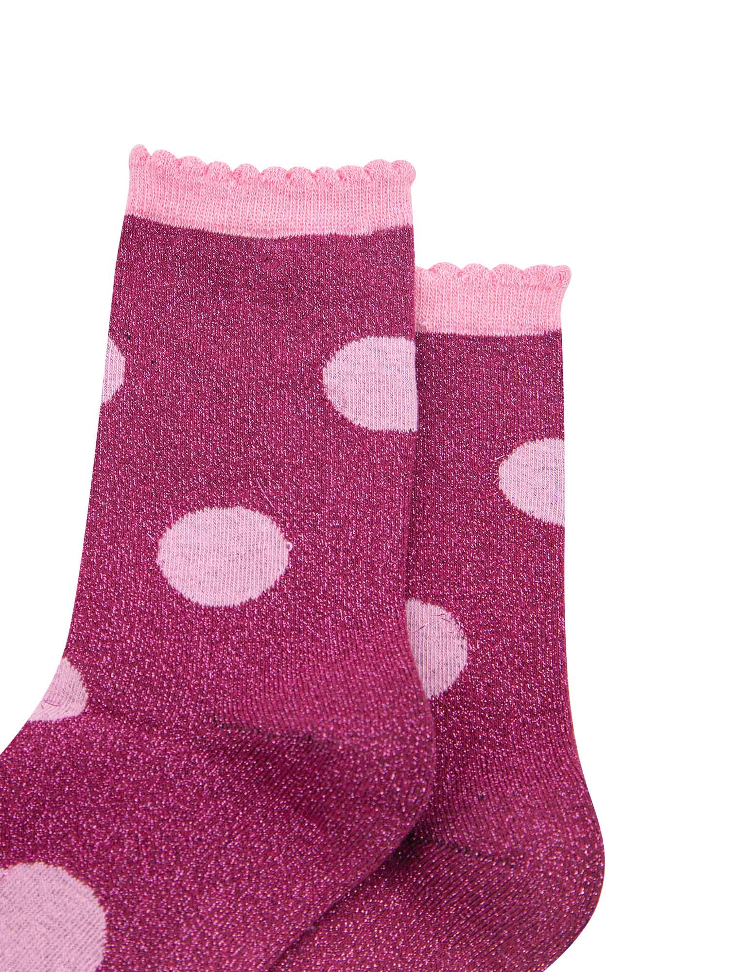 close up of the silver glitter sparkle of the ankle socks, also showing clearly the scalloped cuff
