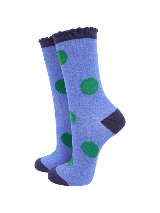 denim blue socks with a navy blue heel, toe and cuff with an all over green polka dot pattern and scalloped cuff