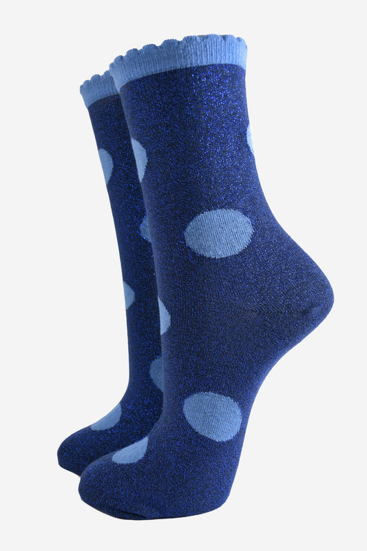 navy blue socks with a large light blue polka dot pattern and scalloped cuff