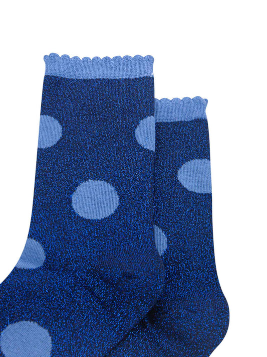 navy blue socks with a large light blue polka dot pattern and scalloped cuff