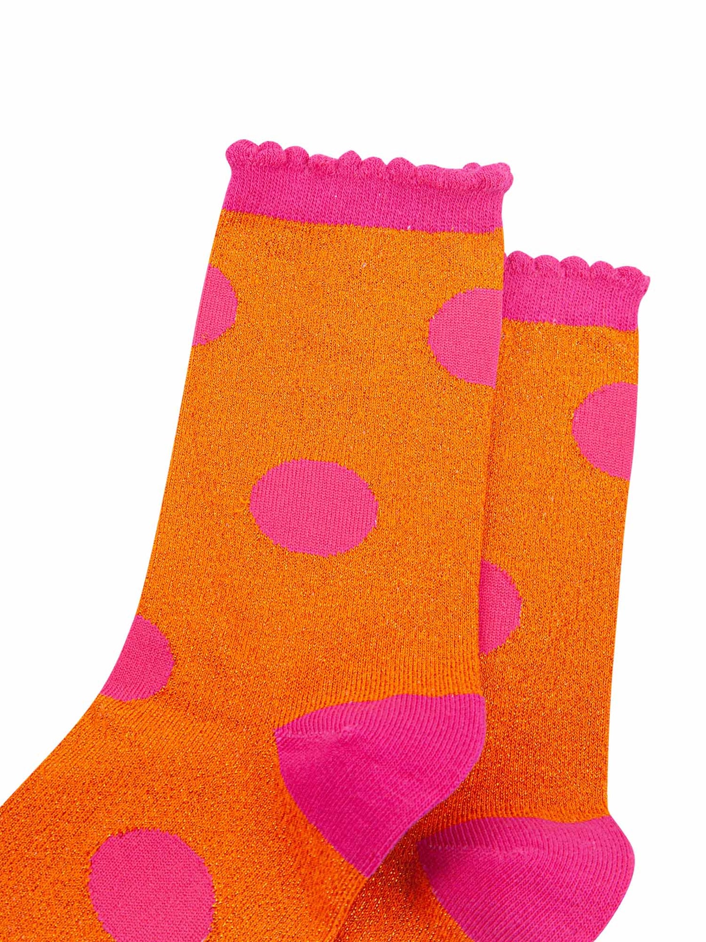 close up of the orange and pink sparkly glitter material