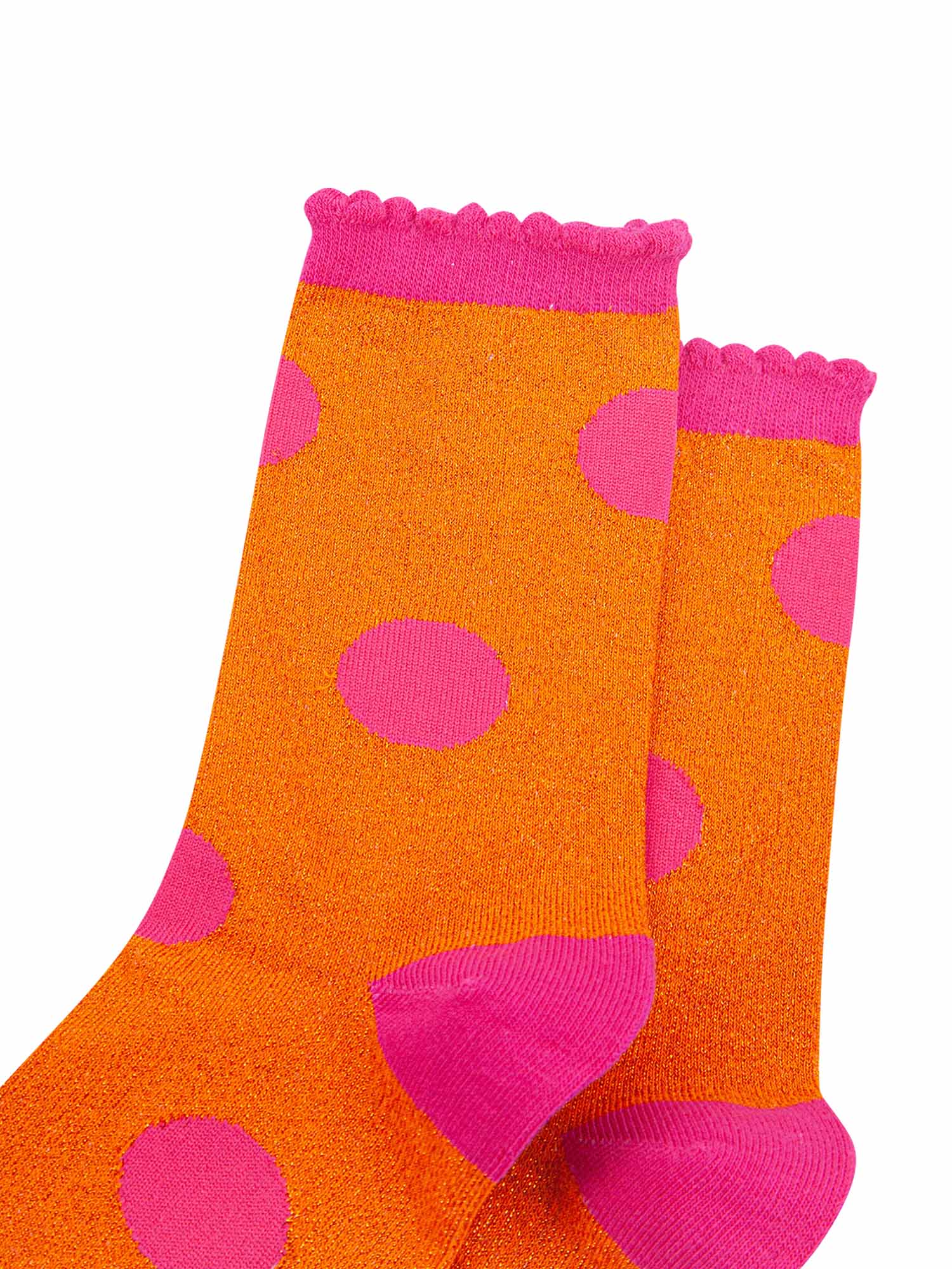 close up of the orange and pink sparkly glitter material