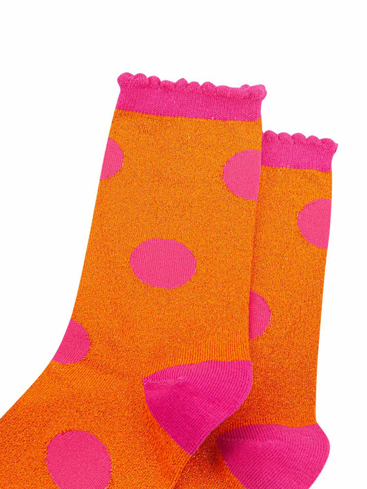 close up of the orange and pink sparkly glitter material