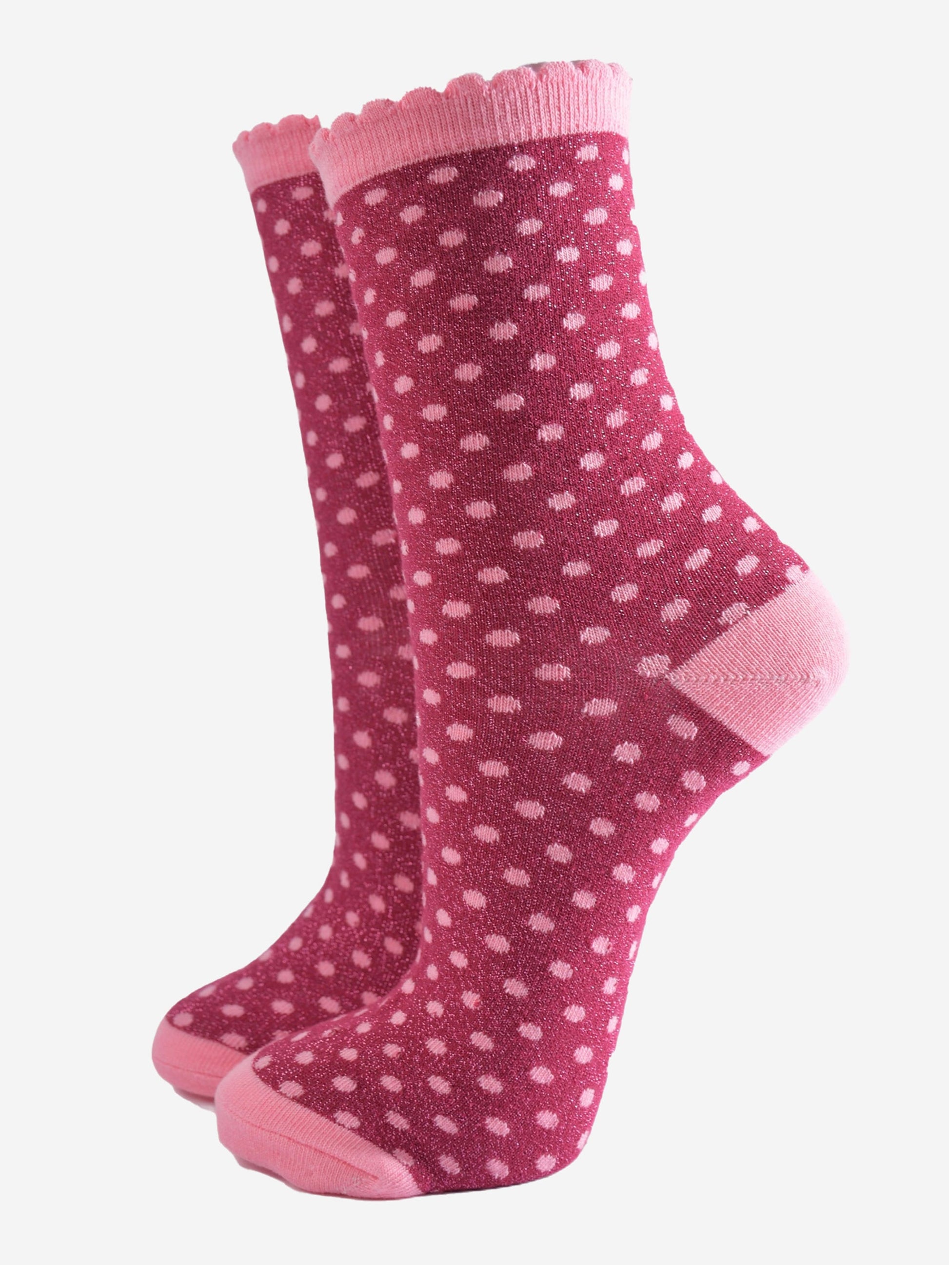dark berry pink ankle socks with an all over pattern of small red polka dots