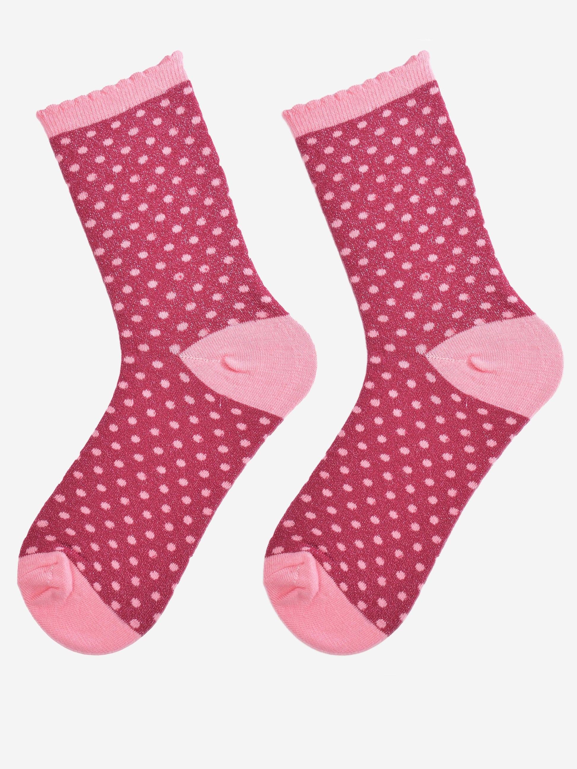 showing the sparkly glitter socks laying flat, the small pink polka dot pattern is all over the sock as is the glitter sparkle