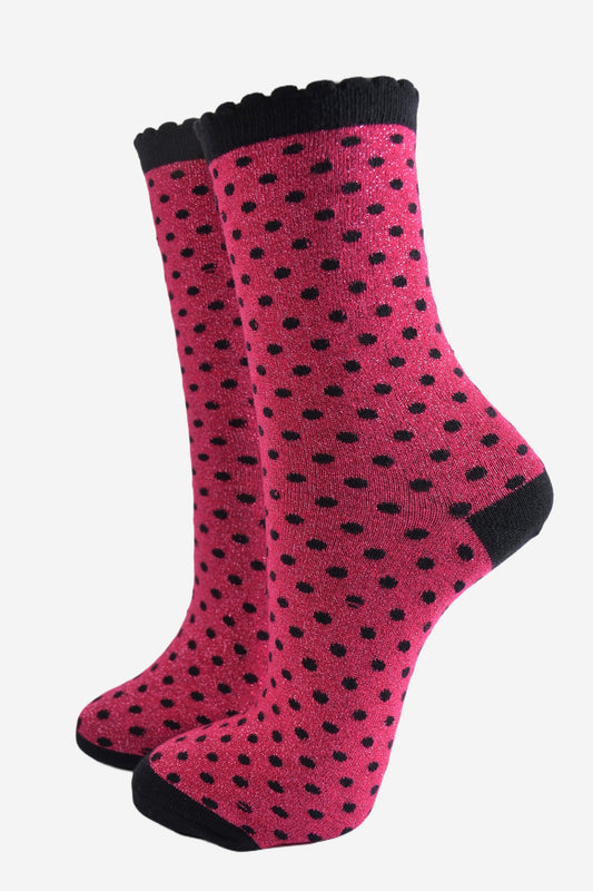 hot pink ankle socks with an all over pattern of small black polka dots