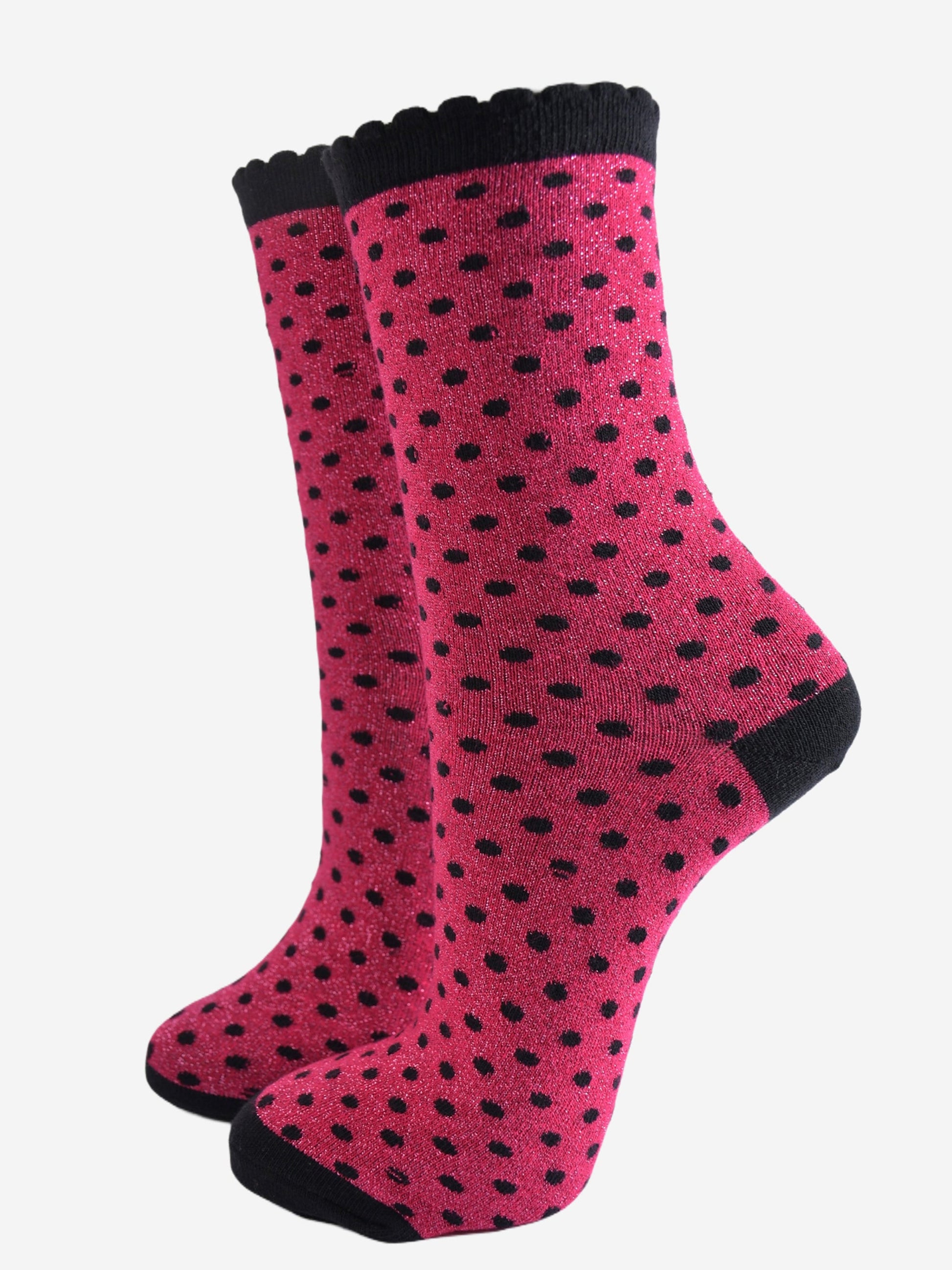 hot pink ankle socks with an all over pattern of small black polka dots