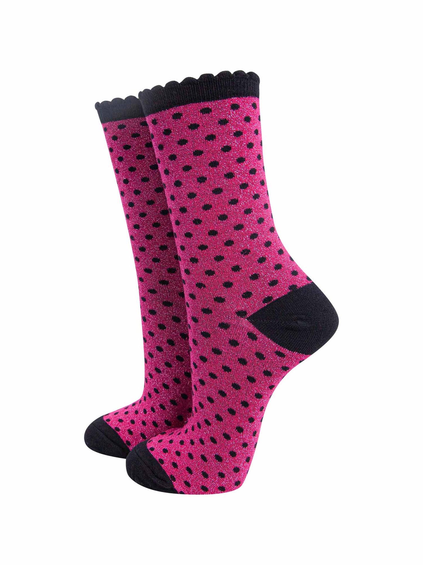 hot pink ankle socks with an all over pattern of small black polka dots