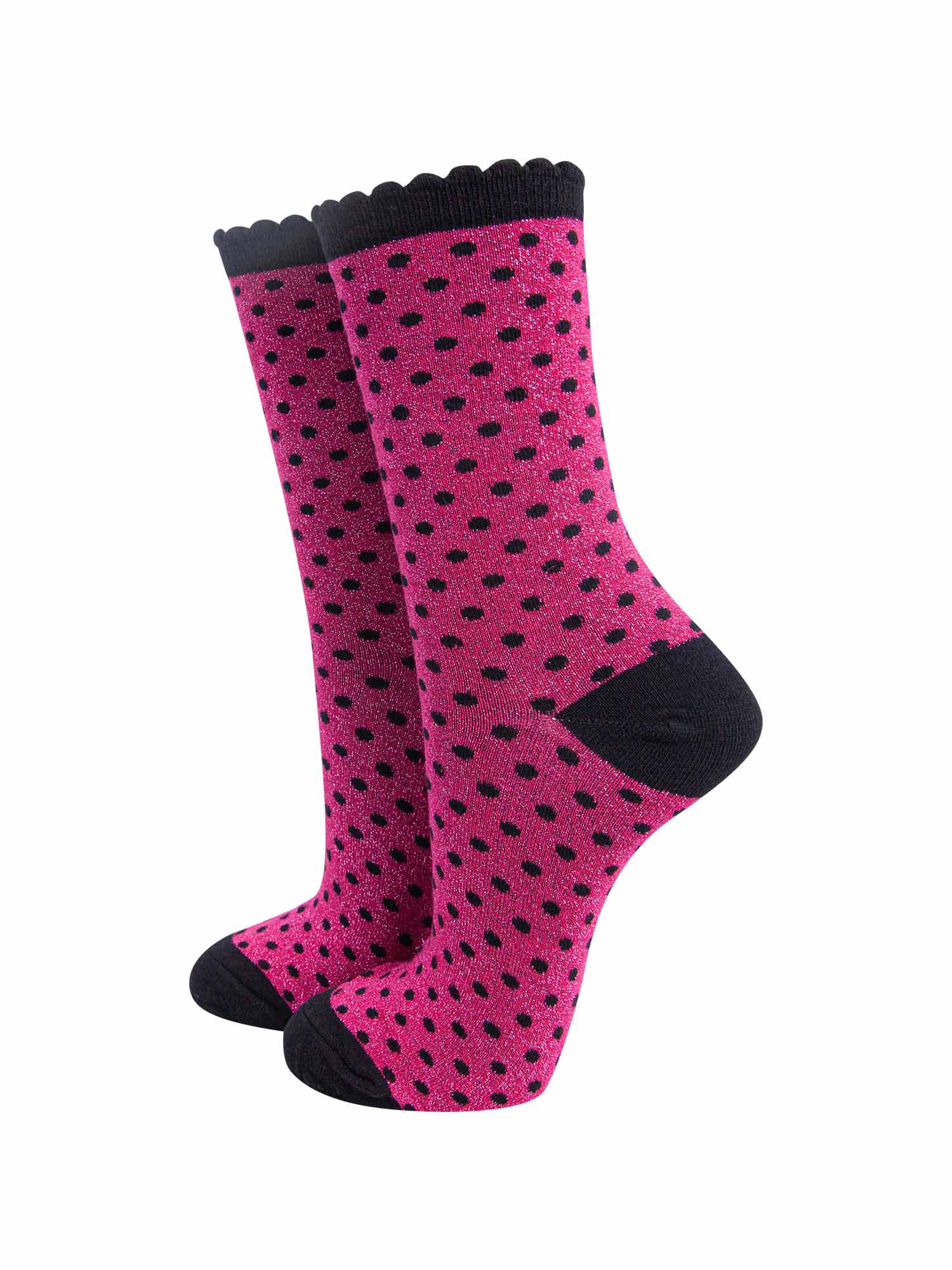 hot pink ankle socks with an all over pattern of small black polka dots