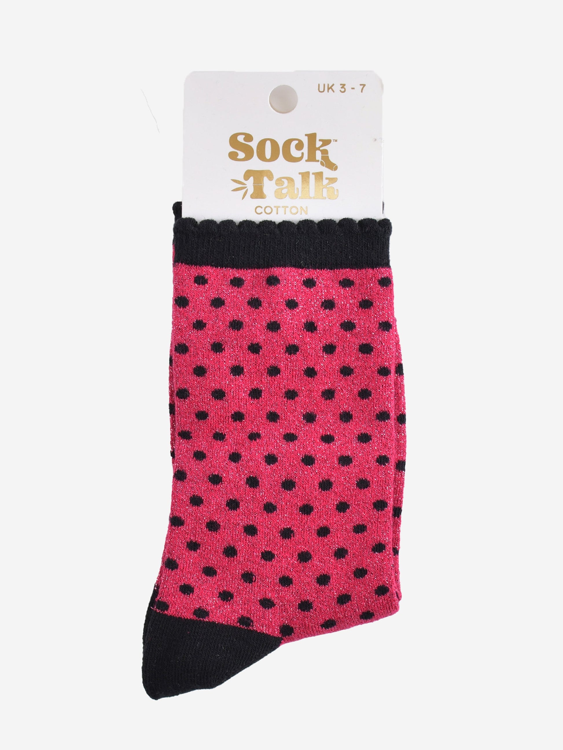 hot pink and black polka dot glitter socks in their sock talk packaging, the socks are a uk size 3-7