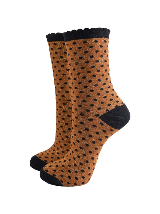 pumpkin orange ankle socks with an all over pattern of small black polka dots