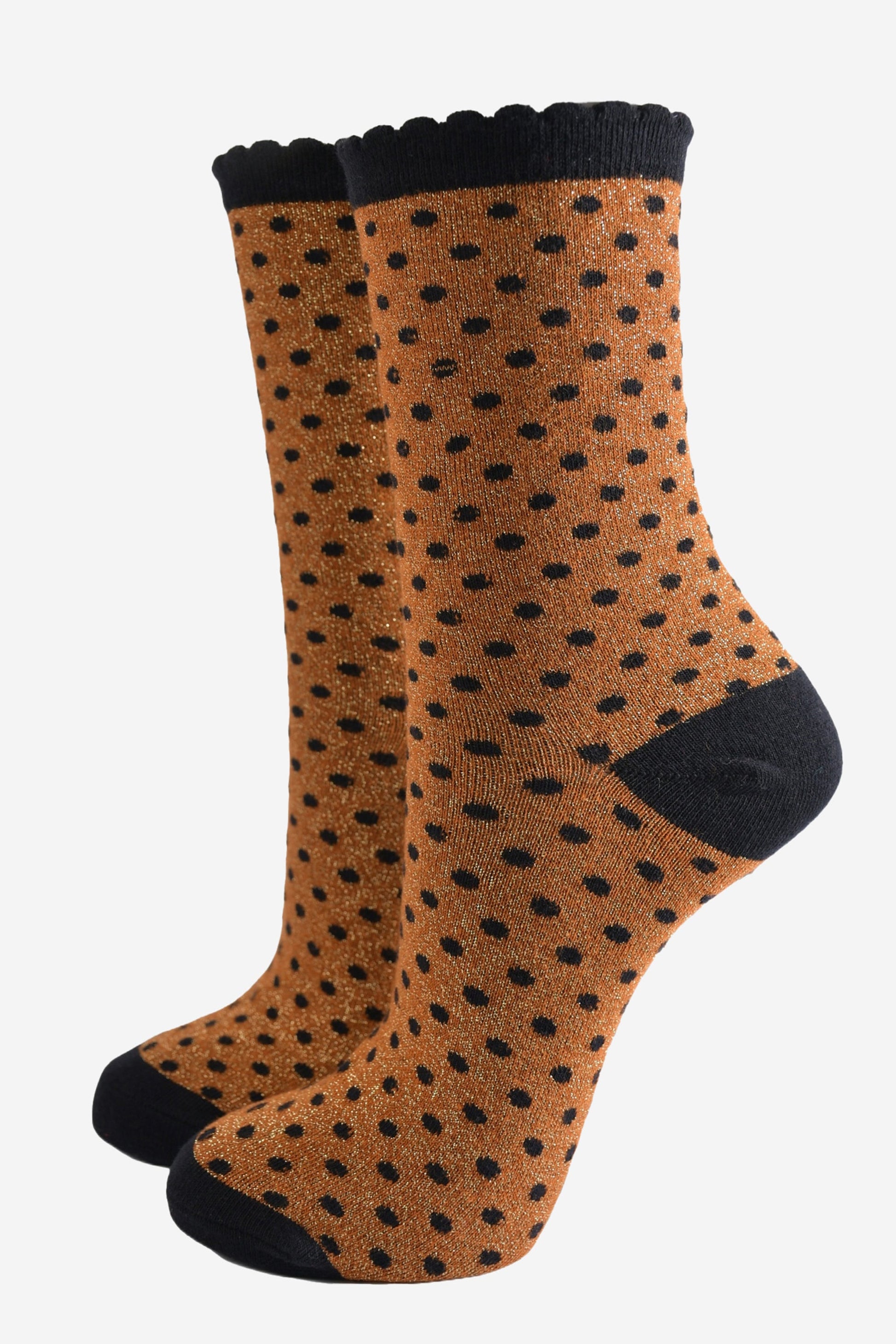 pumpkin orange ankle socks with an all over pattern of small black polka dots