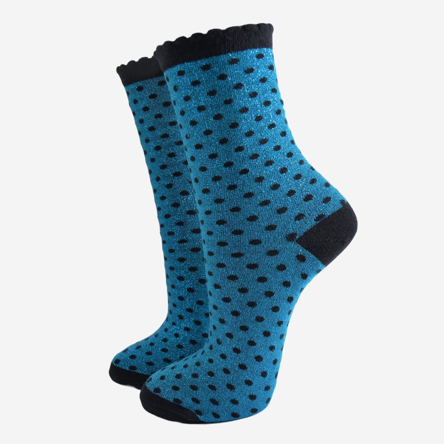 teal blue ankle socks with an all over pattern of small black polka dots