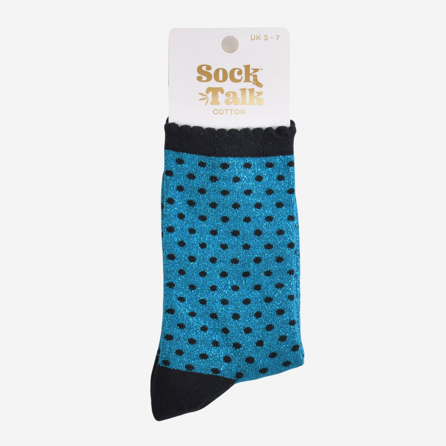 teal and black polka dot glitter socks in their sock talk packaging, the socks are a uk size 3-7