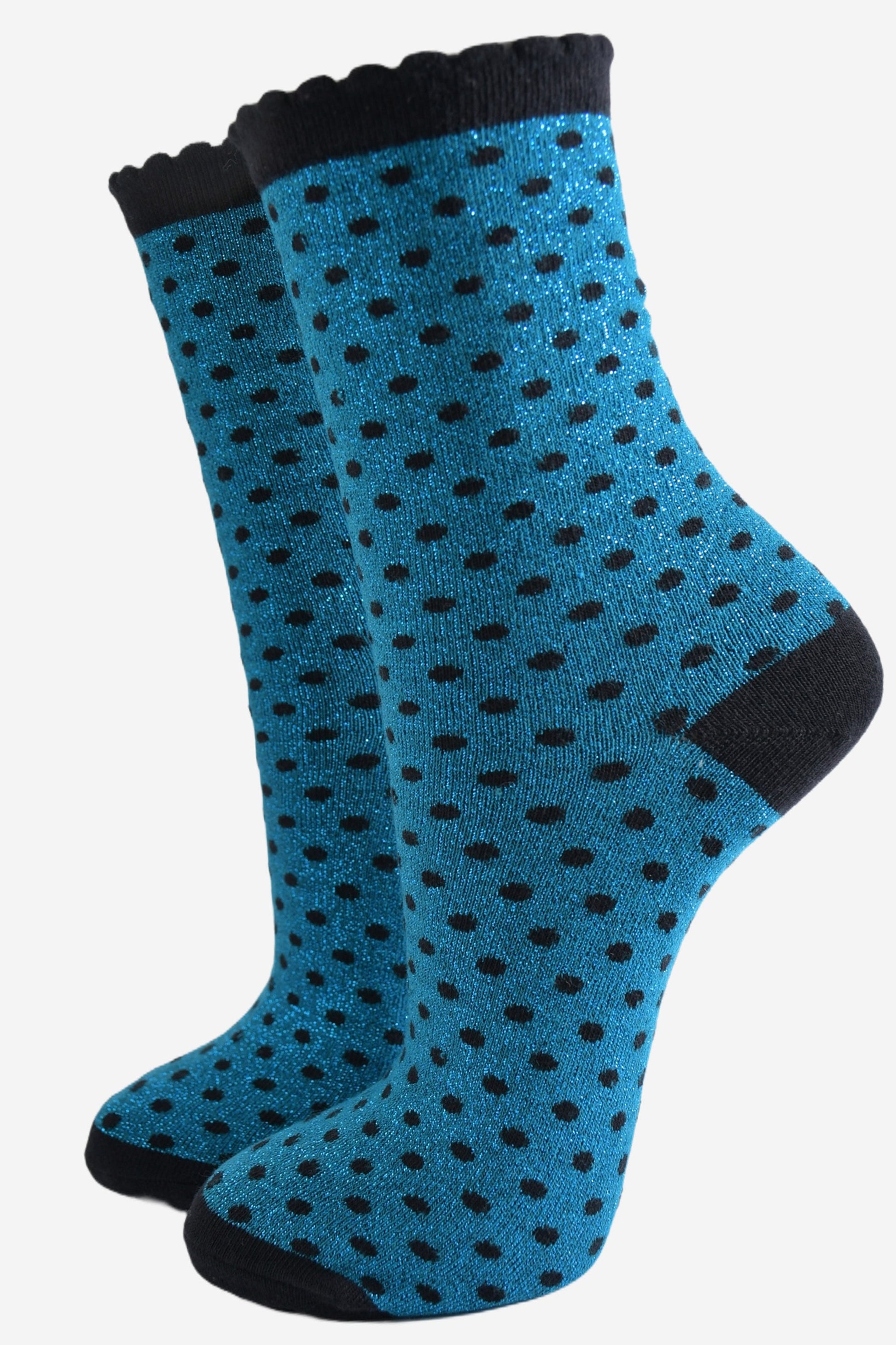 teal blue ankle socks with an all over pattern of small black polka dots