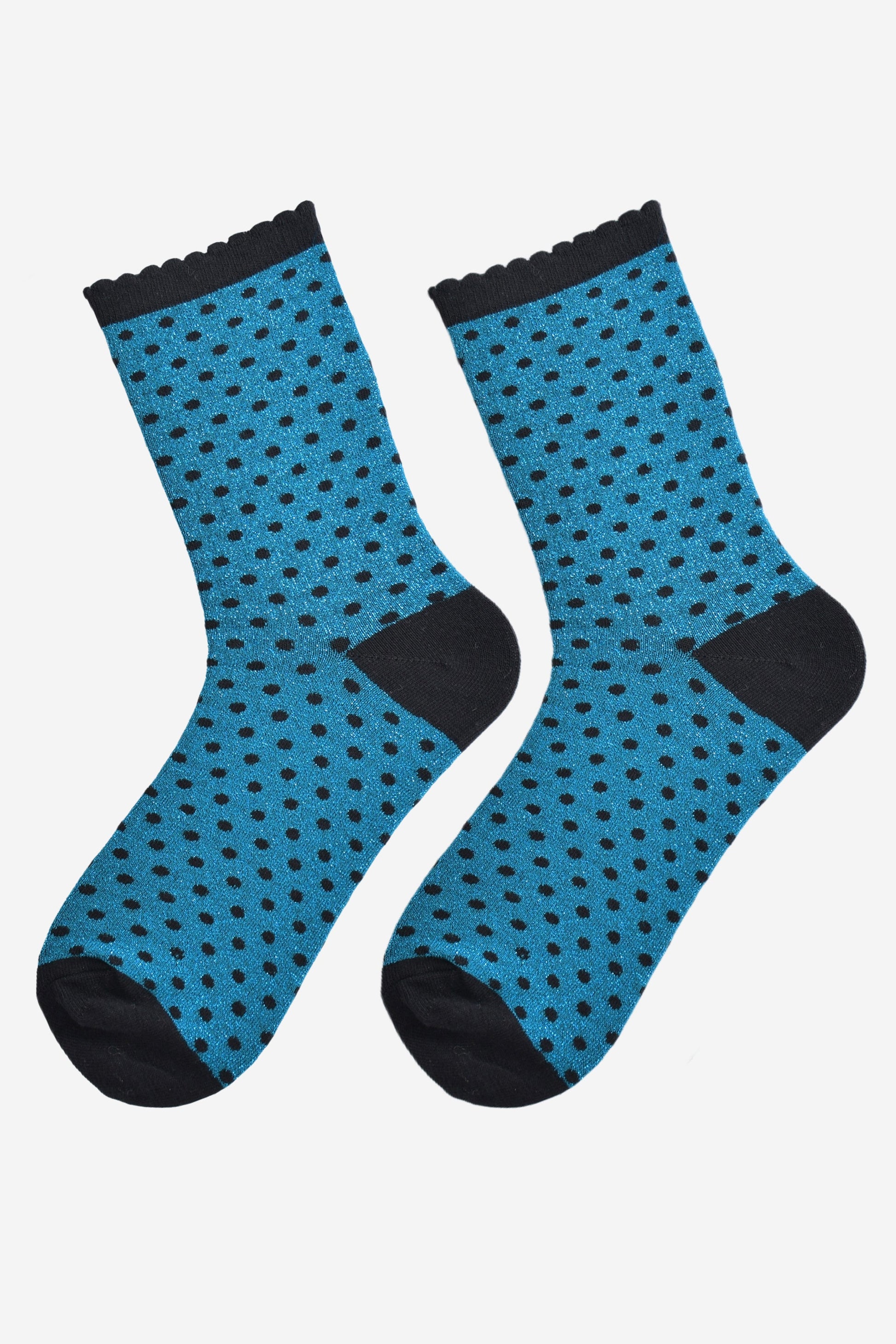 teal and black polka dot socks laying flat, showing the all over glitter sparkle