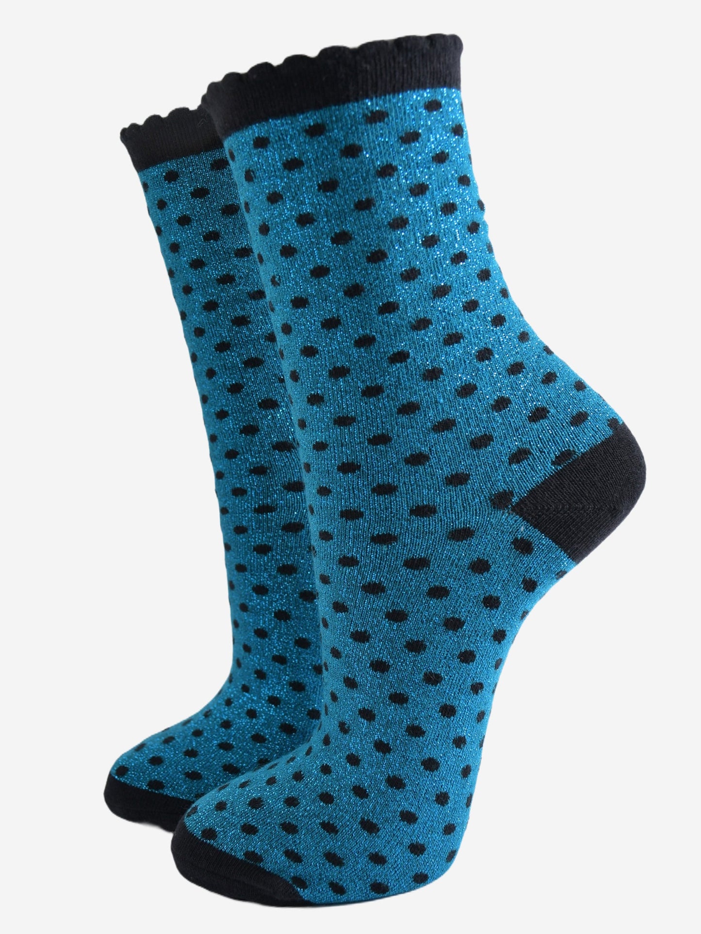 teal blue ankle socks with an all over pattern of small black polka dots