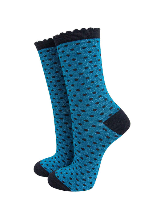 teal blue ankle socks with an all over pattern of small black polka dots