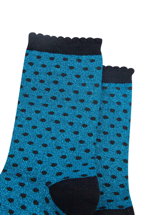 close up of the sparkly polka dot socks, showing the all over shimmer
