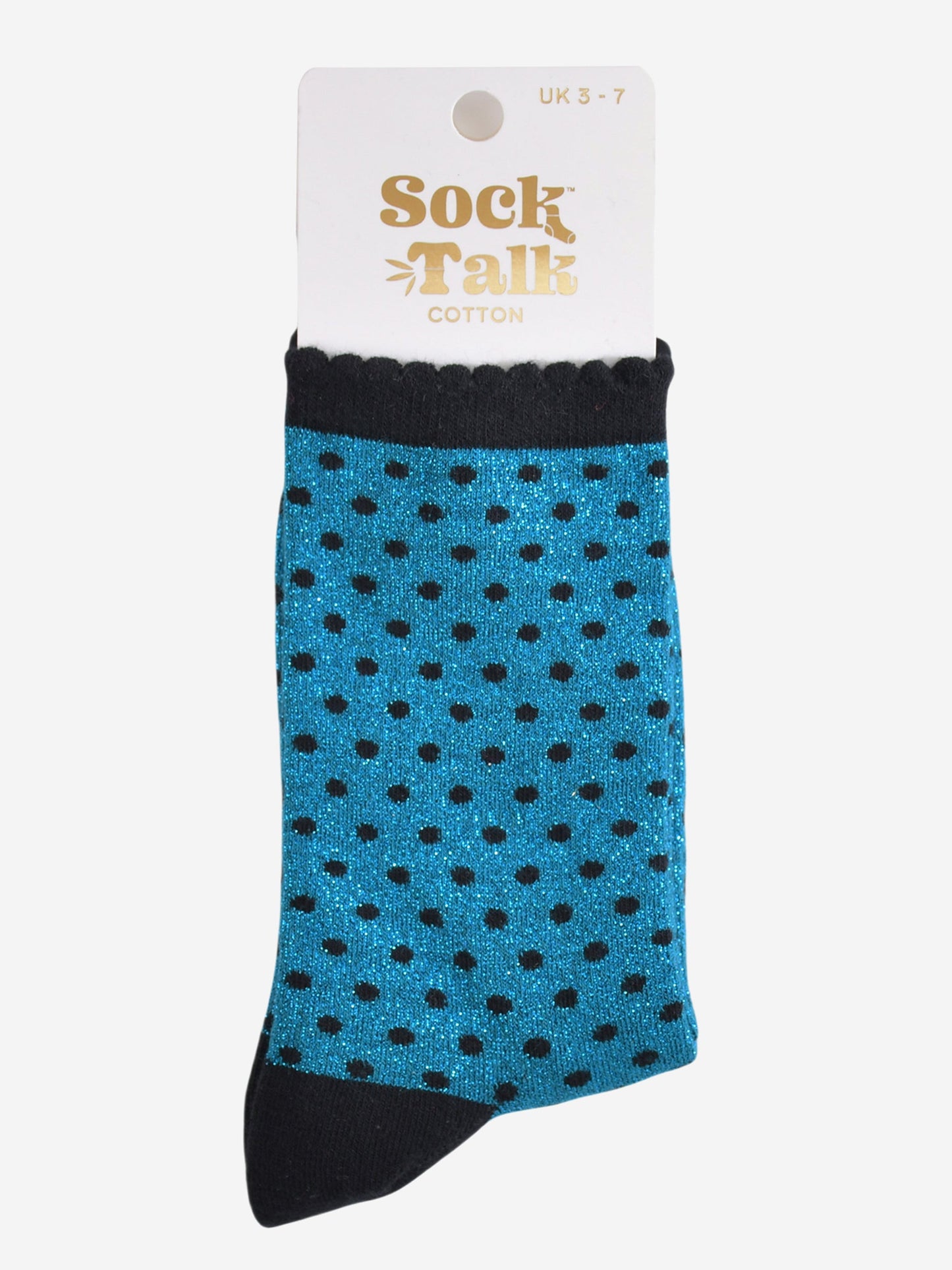 teal and black polka dot glitter socks in their sock talk packaging, the socks are a uk size 3-7