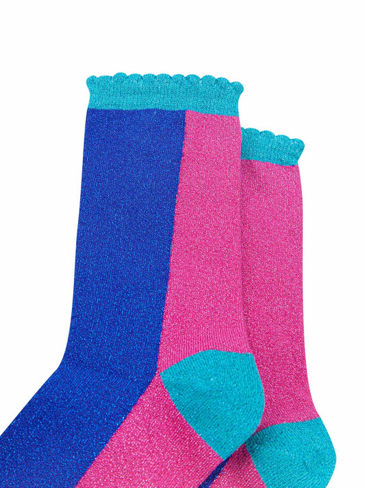 close up of the pink and blue glitter socks showing an all over sparkly effect