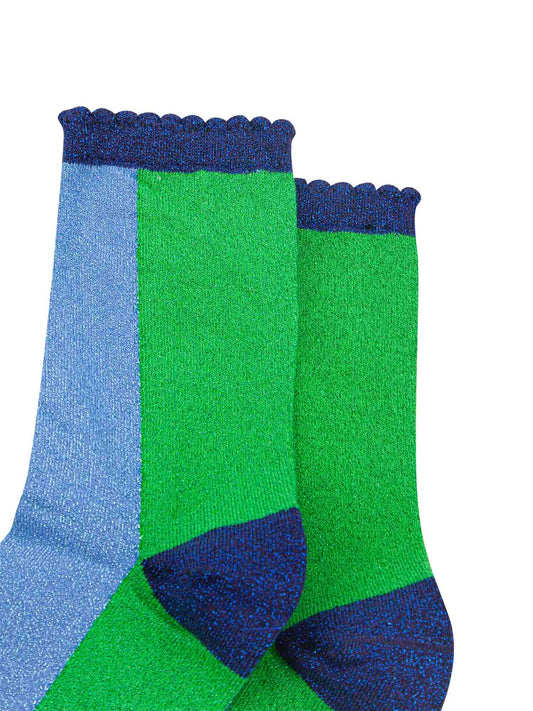 close up of the all over glitter sparkle on these colourful green and blue glitter socks