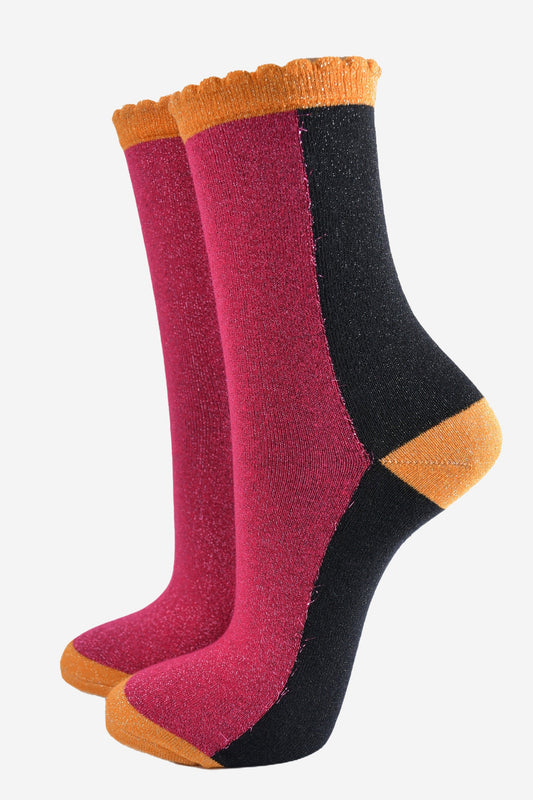 pink and black block socks with orange heel, toe and cuff with an all over glitter sparkle and scalloped edge