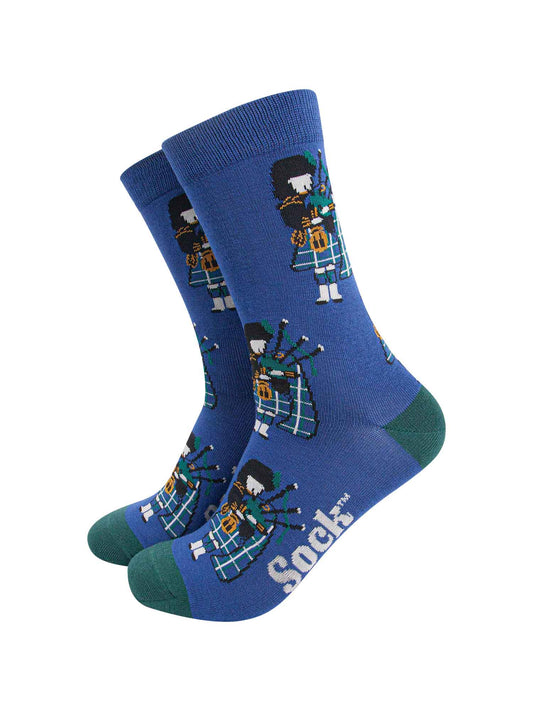mens blue bamboo socks featuring a traditional Scottish bagpipe player wearing a kilt