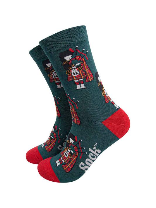 mens green bamboo socks featuring a scottish bagpipe player wearing a traditional red kilt