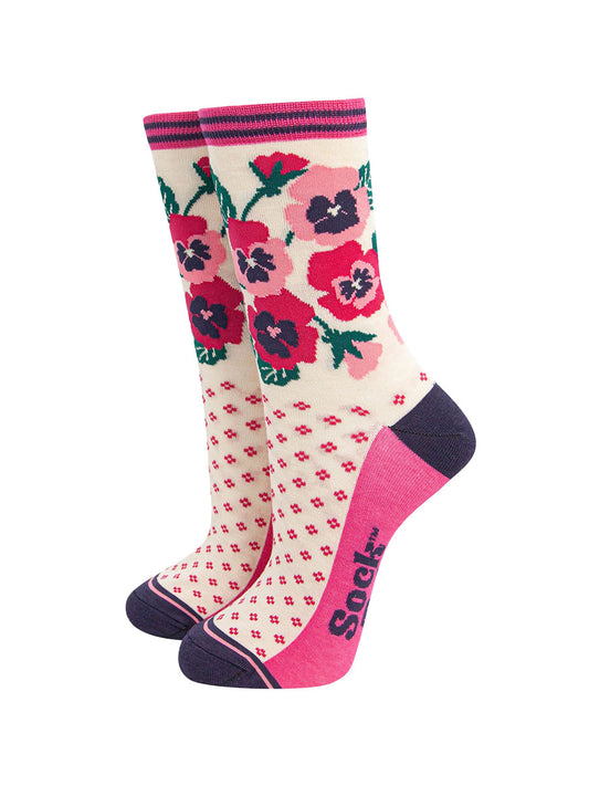 cream bamboo socks with a navy blue heel and toe and fuchsia pink sole. the ankle of the socks is covered with a fuchsia pink and light pink pansy flower arrangement.