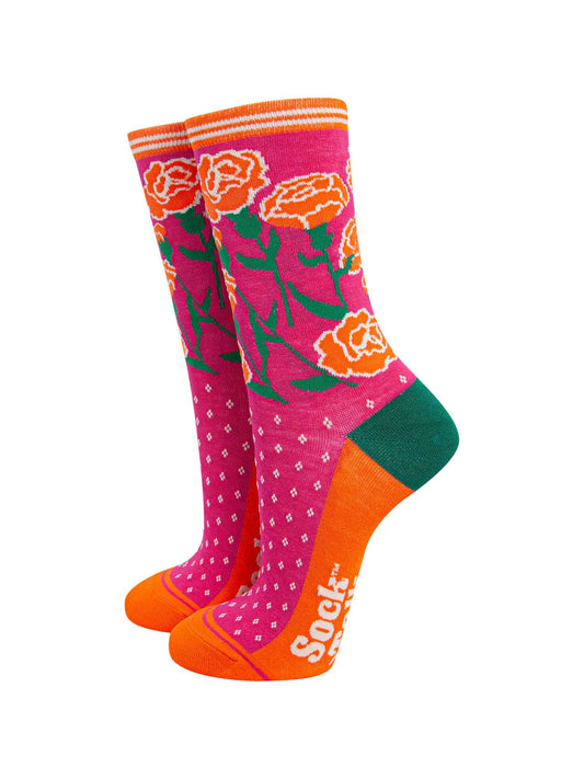 pink and orange ankle socks featuring an arrangement of carnation flowers