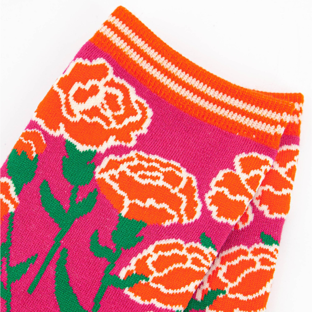 close up of the carnation floral design on the ankle of the socks