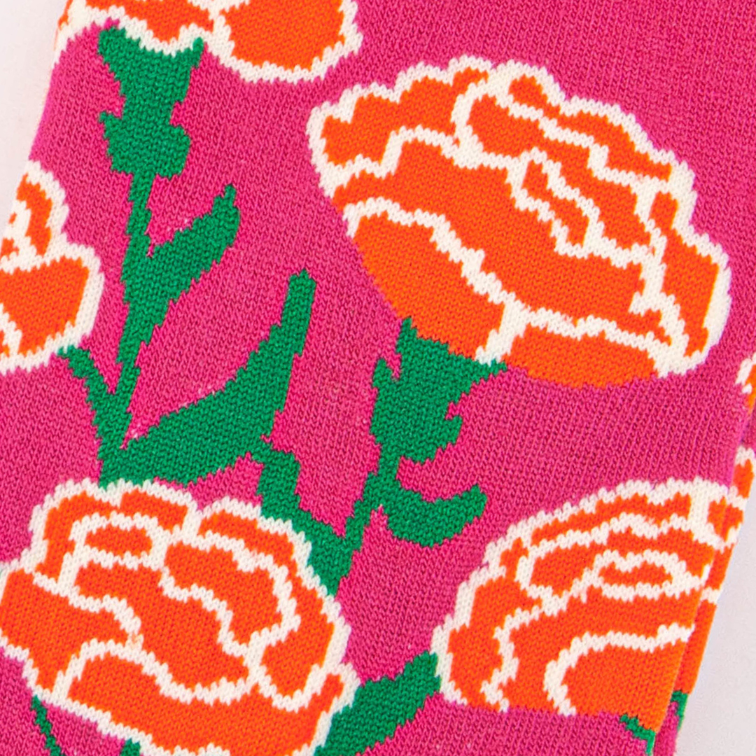 close up of the carnation floral design on the ankle of the socks