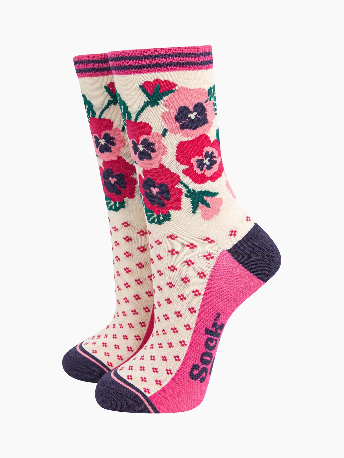 cream bamboo socks with a navy blue heel and toe and fuchsia pink sole. the ankle of the socks is covered with a fuchsia pink and light pink pansy flower arrangement. 