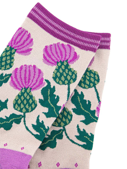 close up of the scottish thistle design, showing the purple and green colours of the flower