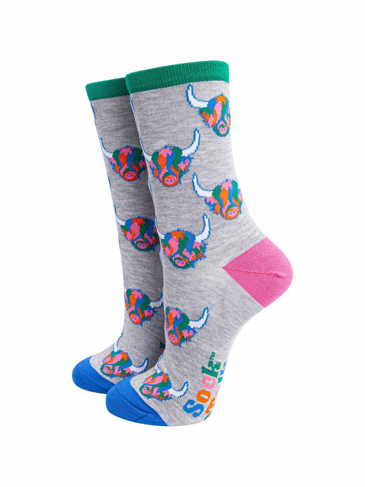 mens grey dress socks with an all over pattern of multicoloured highland cow faces