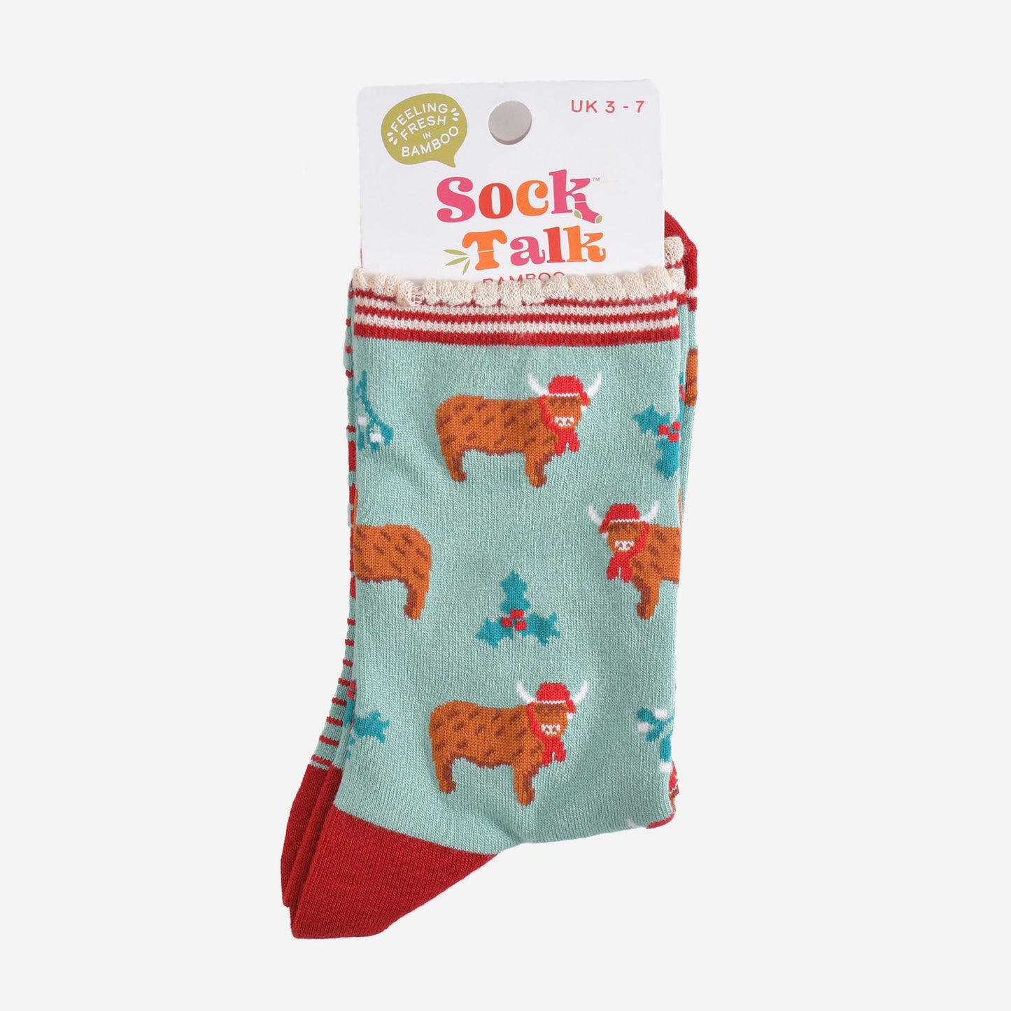 green and red highland cow bamboo socks in their sock talk packaging, these socks are a uk size 3-7