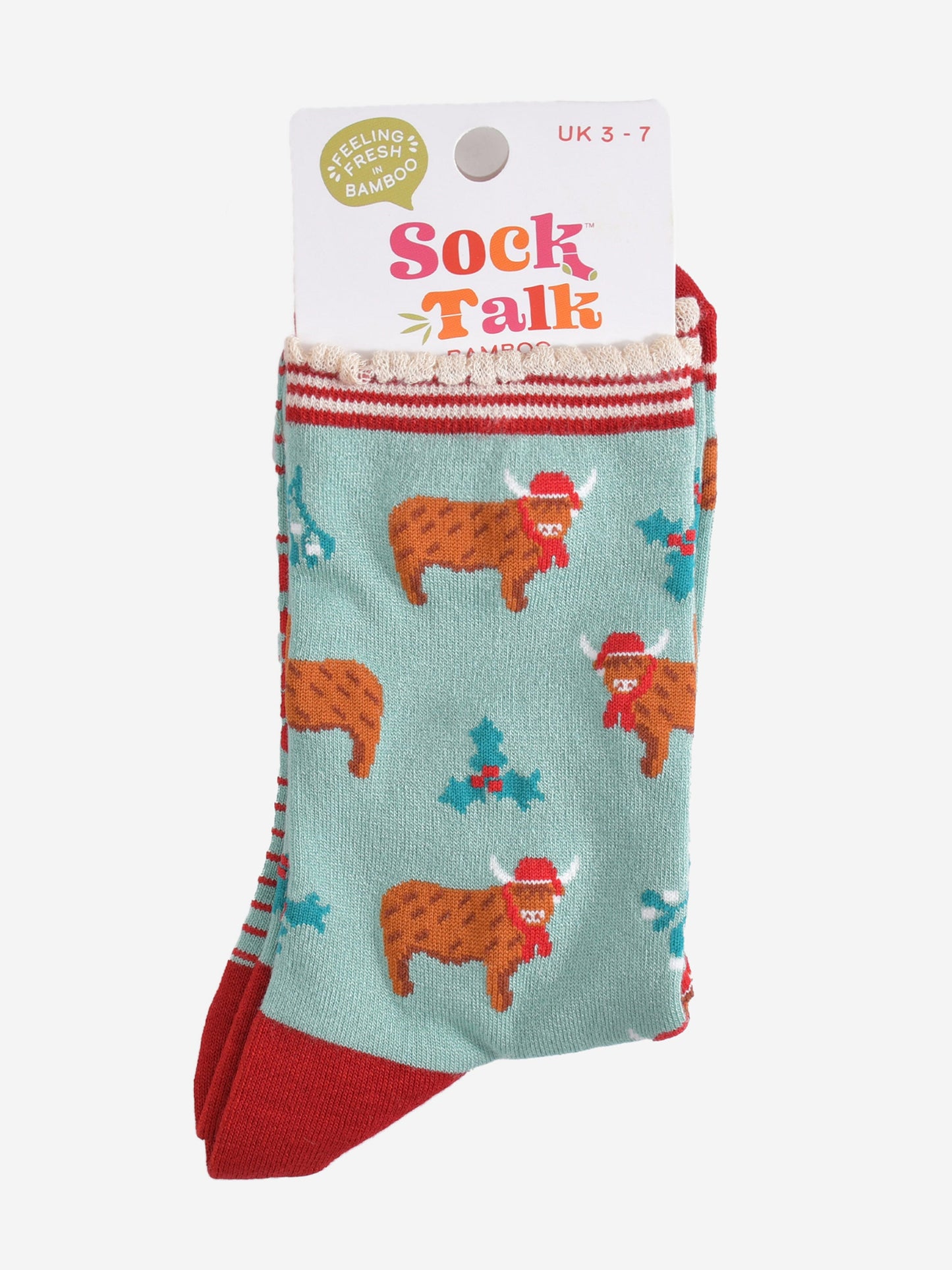 green and red highland cow bamboo socks in their sock talk packaging, these socks are a uk size 3-7