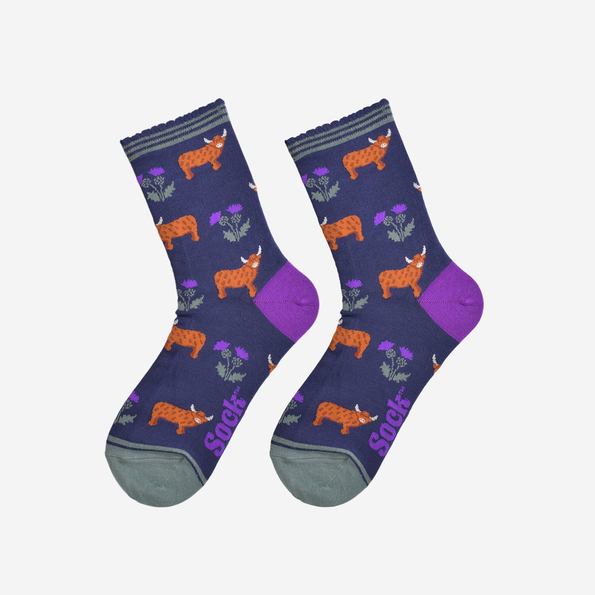 highland cow and thistle socks laying flat, showing the all over thistle floral pattern and standing highland cows