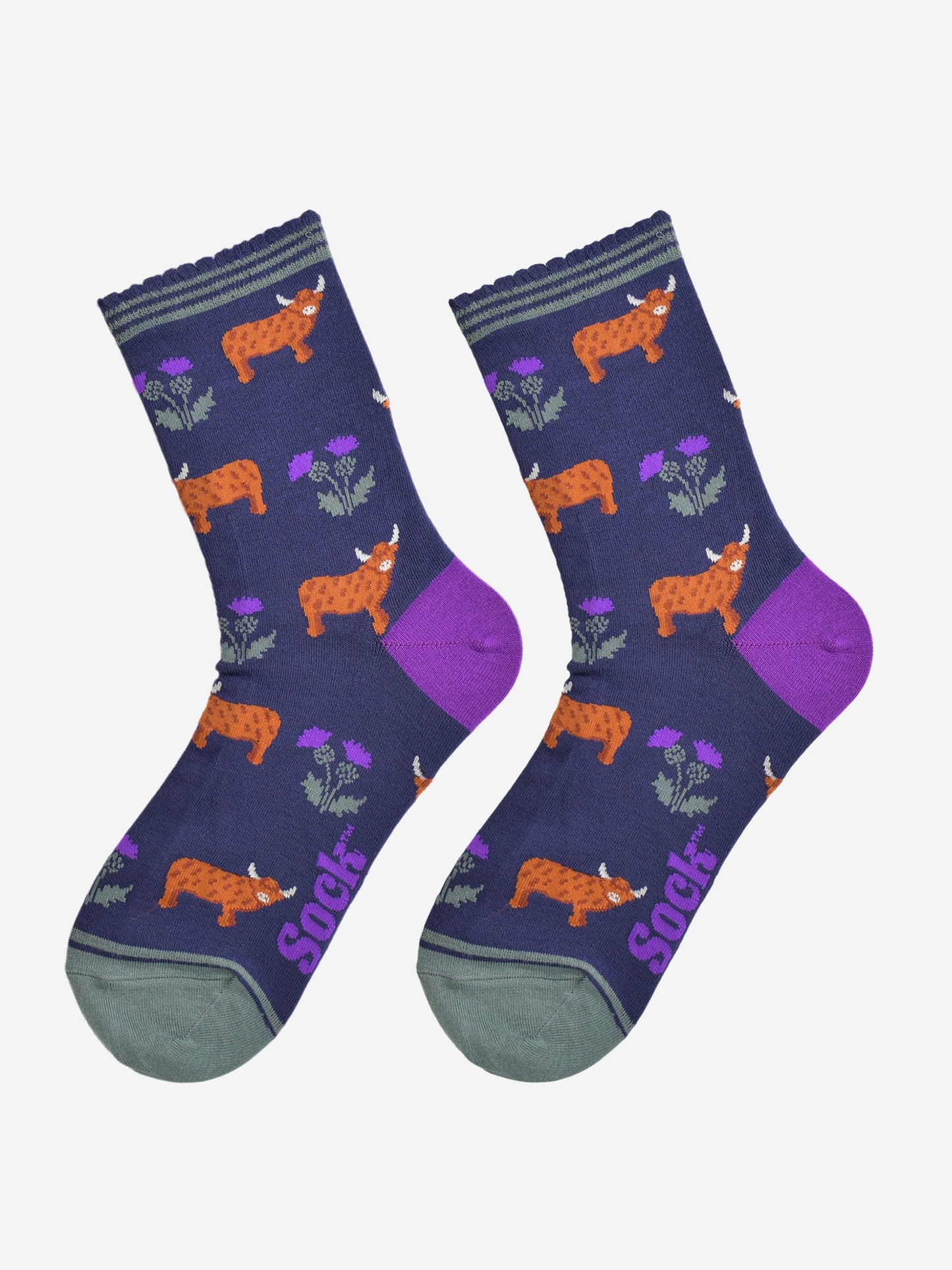 highland cow and thistle socks laying flat, showing the all over thistle floral pattern and standing highland cows