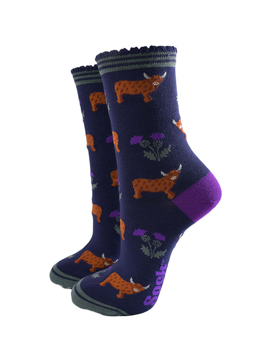 navy blue scalloped cuff ankle socks with a pattern of highland cows and thistles