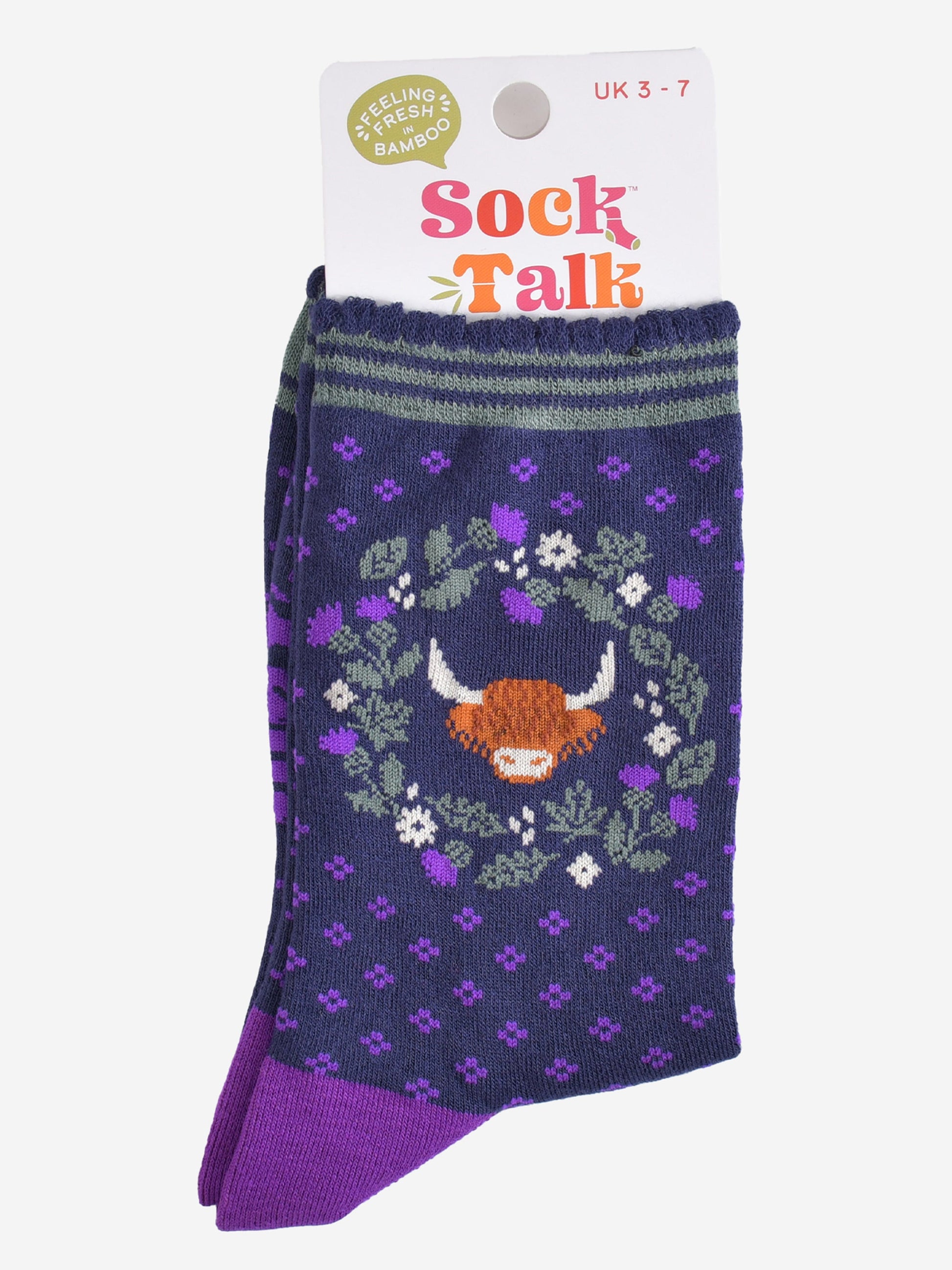 highland cow thistle wreath bamboo socks in their sock talk packaging, the socks are a uk size 3-7