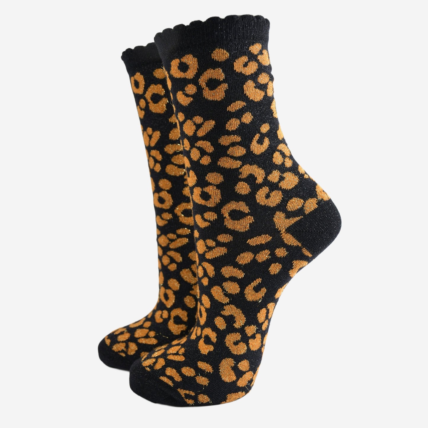 black ankle socks with an orange leopard print pattern, all over glitter sparkle and black scalloped cuff