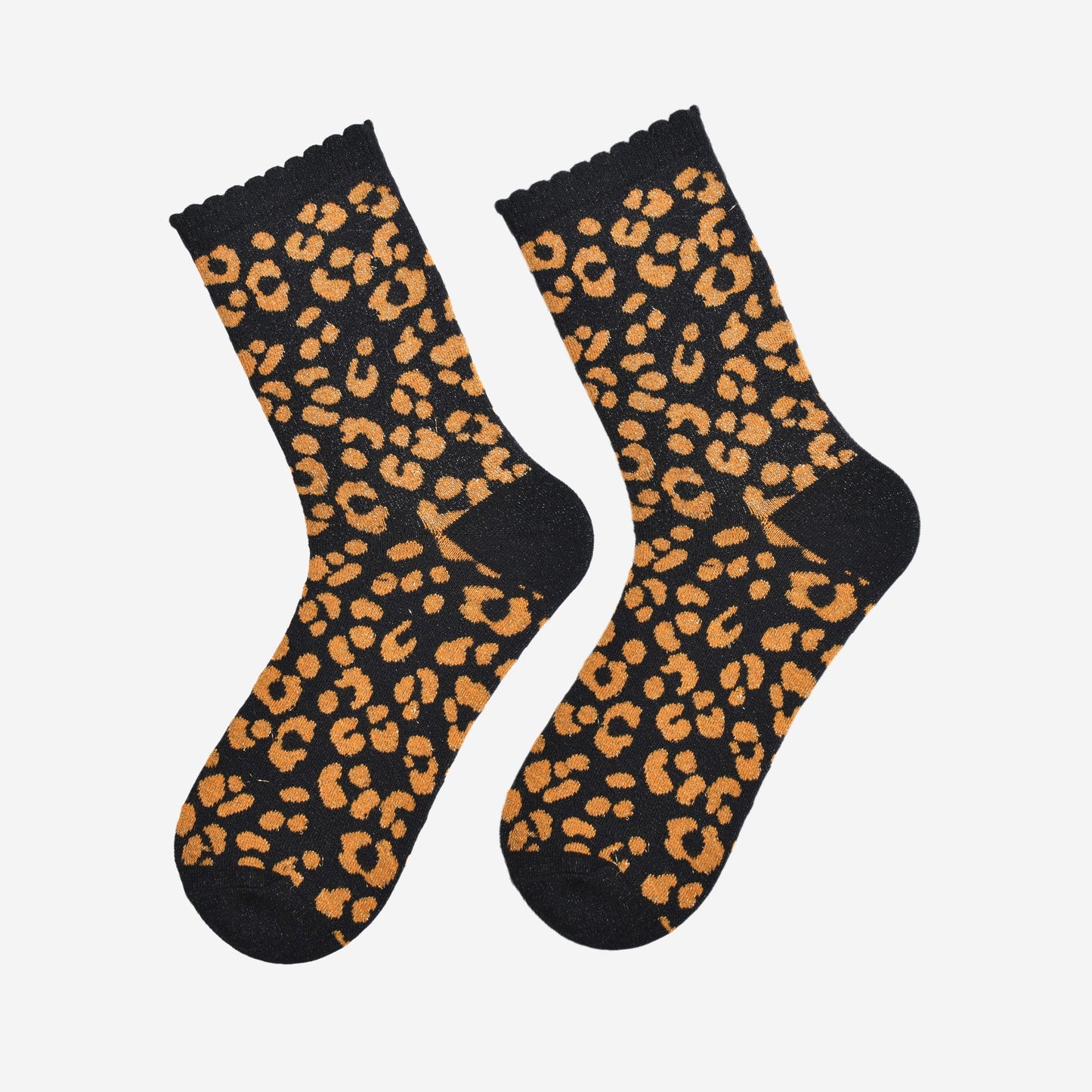 showing the orange and black leopard print ankle socks laying flat, the all over silver sparkle is visible