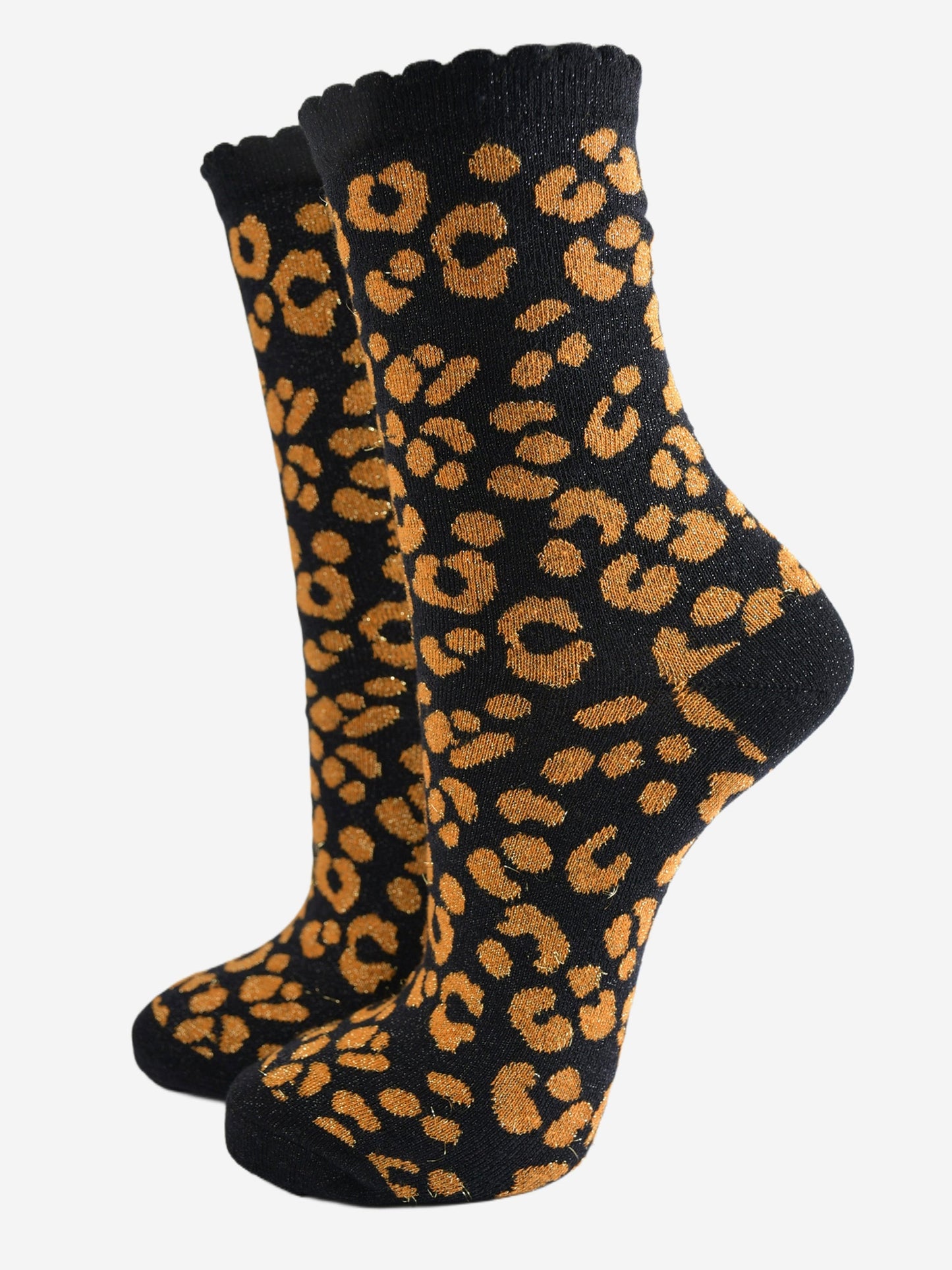 black ankle socks with an orange leopard print pattern, all over glitter sparkle and black scalloped cuff