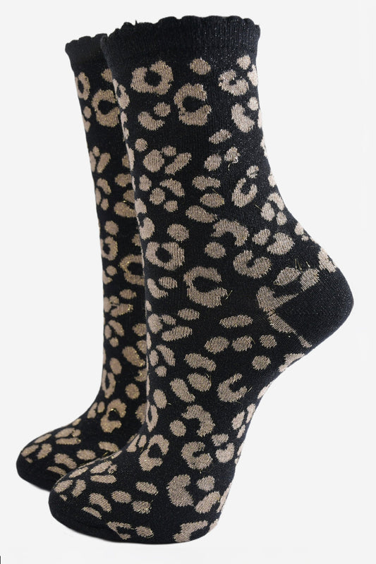 black ankle socks with a gold leopard print pattern, all over glitter sparkle and black scalloped cuff